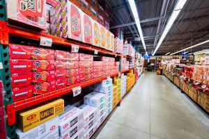 ShuangHurStore-9 Ramen aisle at Shuang Hur Supermarket with shelves fully stocked with instant noodle packs and bulk boxes of assorted brands.